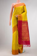 Yellow Dual Tone Kanchipuram Silk Saree with Checked design on the body and Zari Border.  displayed on a mannequin
