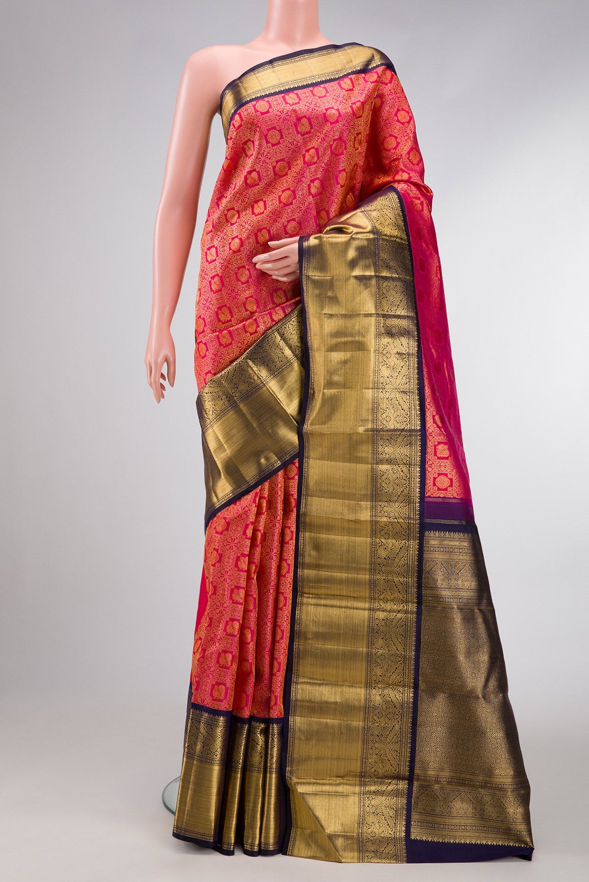 Pink Dual Tone Kanchipuram Silk Saree with Zari Brocade on the body and Zari Border.  displayed on a mannequin