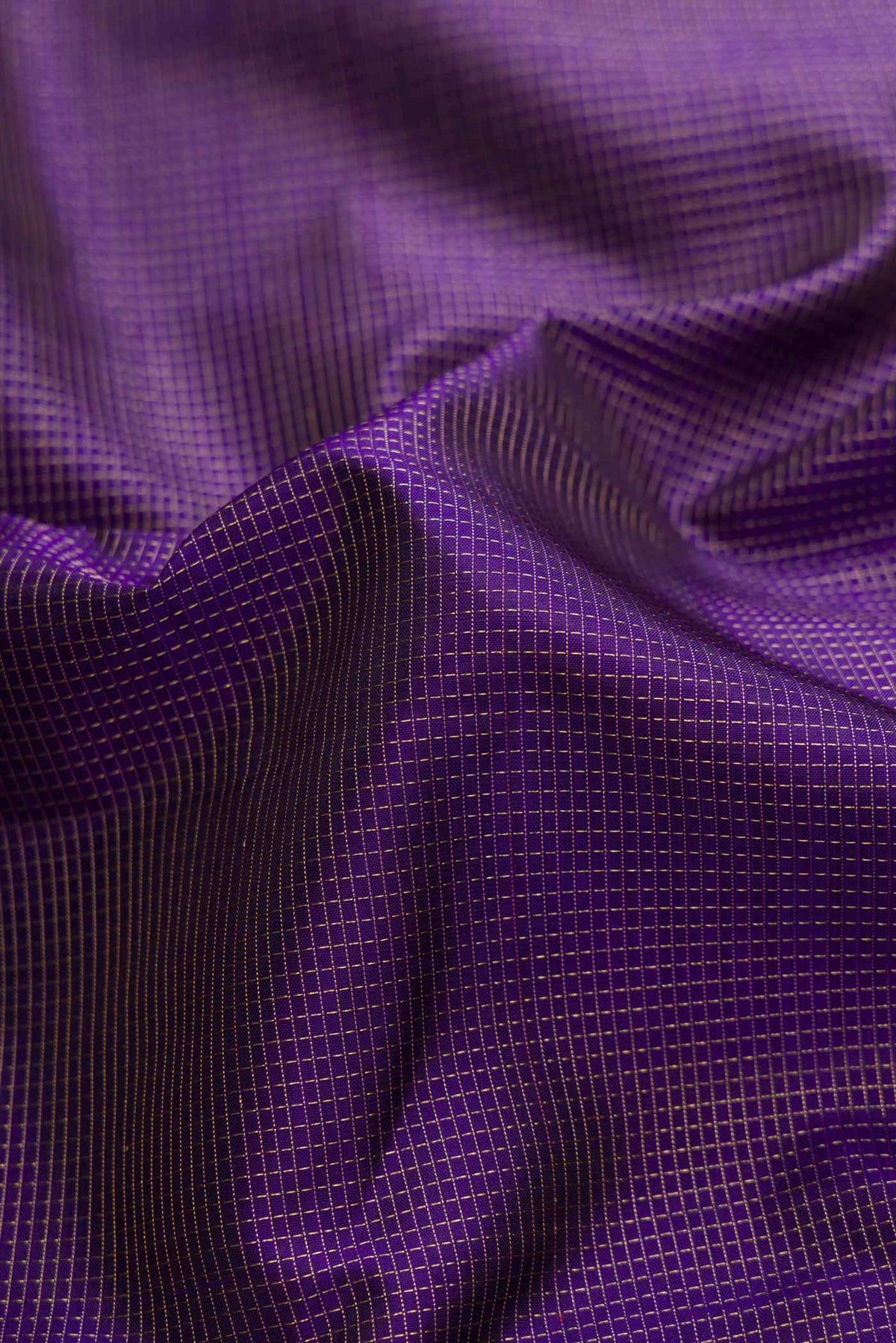 Close up of Pure Silk Pure Zari Navy Blue Dual Tone Kanchipuram Saree with Stripes on the body and Zari Border displaying folds