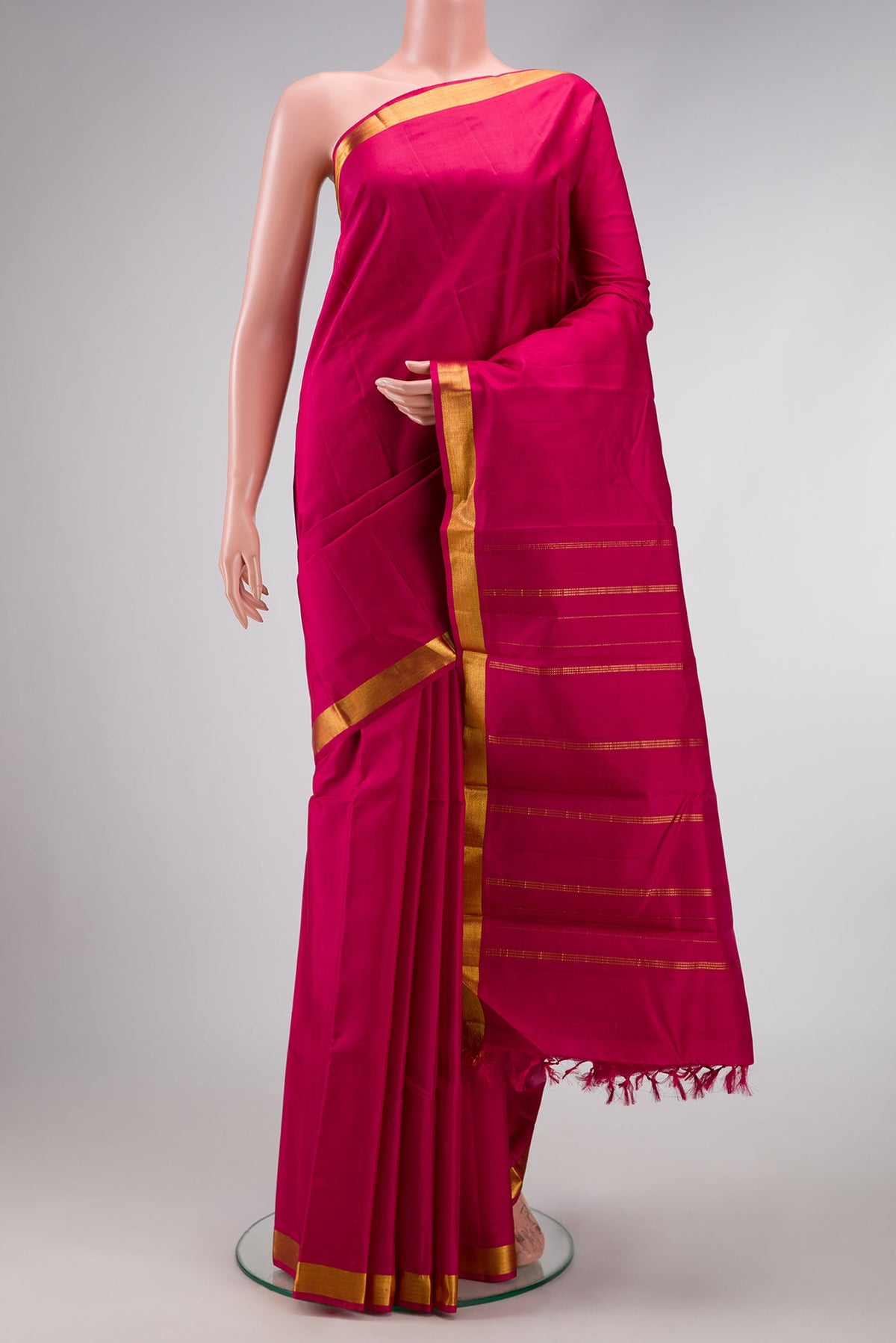 Pure Silk Pure Zari Maroon Dual Tone Kanjivaram Saree with Plain Body and Zari Border.  displayed on a mannequin