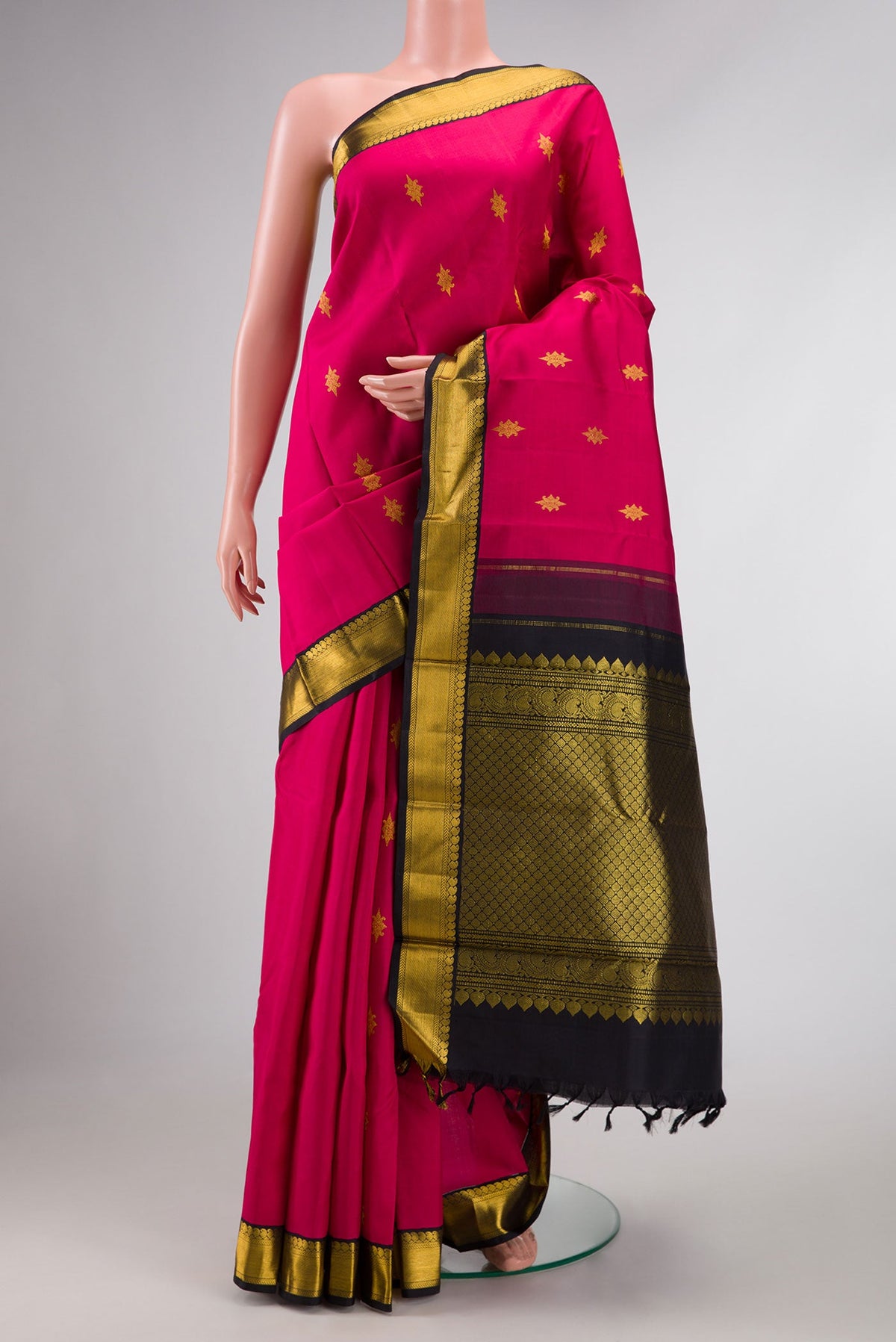Pink Dual Tone Kanchipuram Silk Saree with Zari Butta on the body and Zari Border displayed on a mannequin