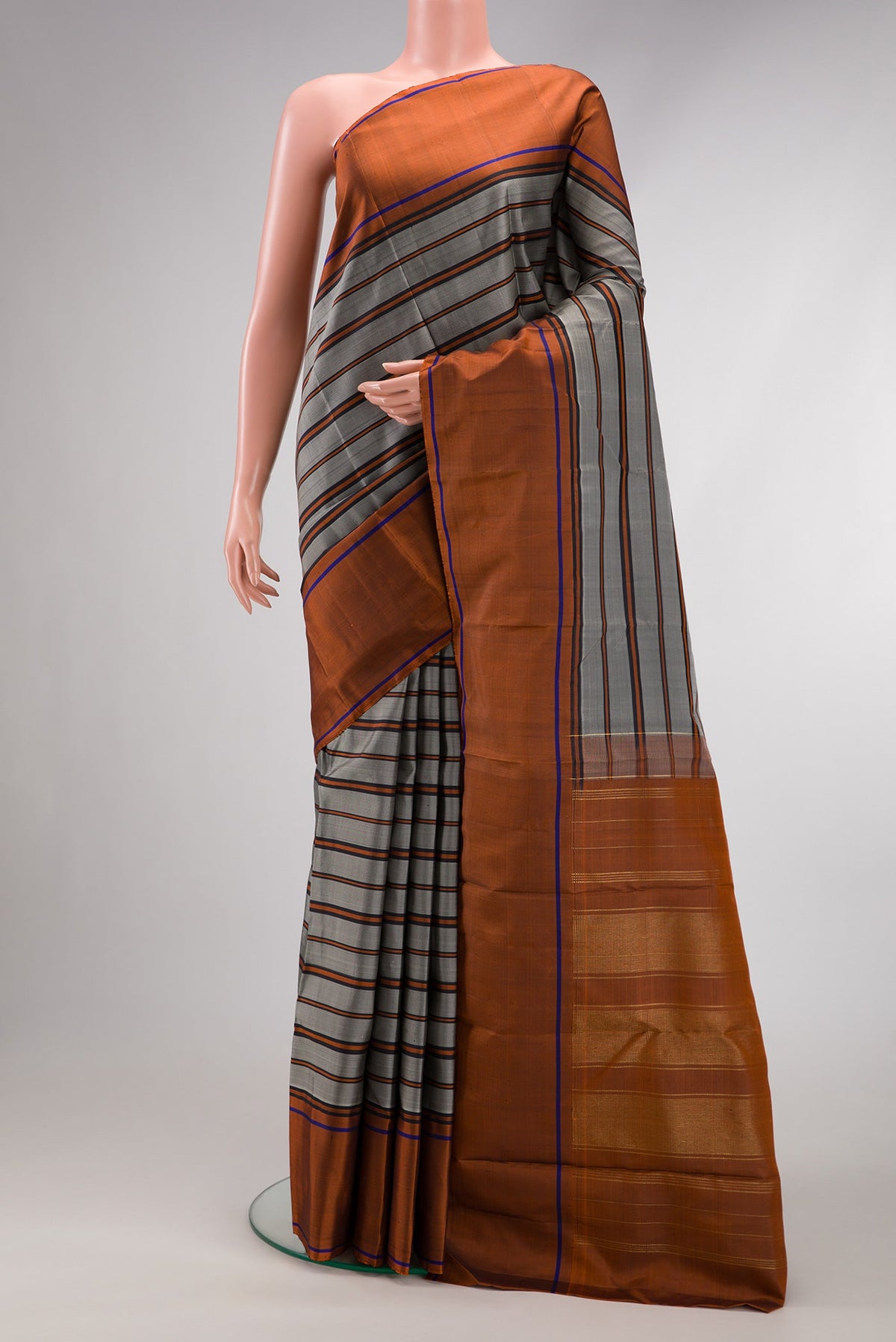 Grey Dual Tone Kanjivaram Silk Saree with Stripes on the body and Plain Border.  displayed on a mannequin