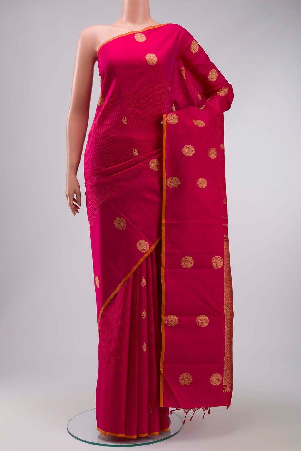 Pink Kanchipuram Silk Saree with Zari Butta on the body and Plain Border displayed on a mannequin