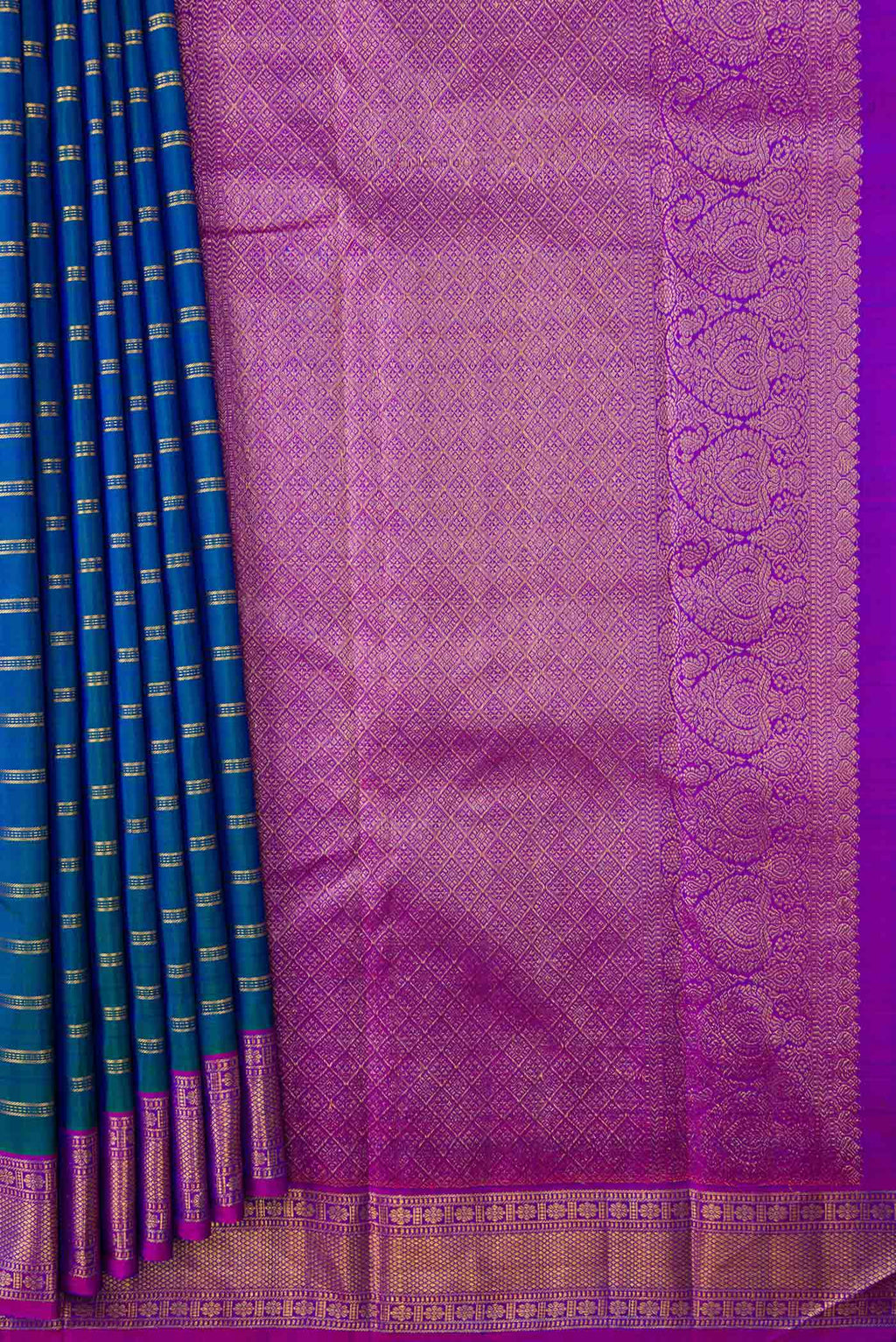 Pleats and pallu of Peacock Blue Dual Tone Kanchipuram Silk Saree with Stripes on the body and Zari Border