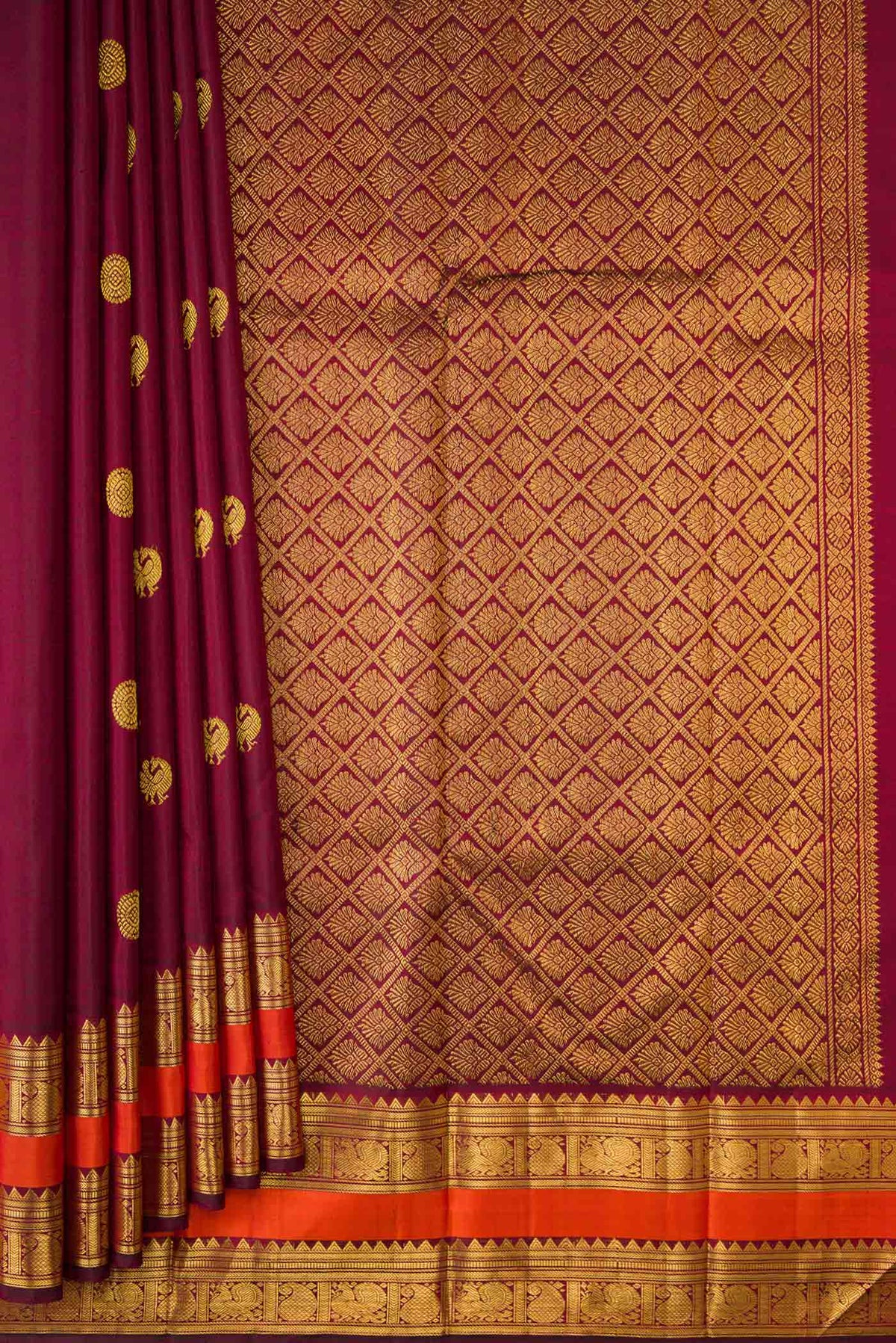 Pleats and pallu of Maroon Dual Tone Kanchipuram Silk Saree with Zari Brocade on the body and Zari Border