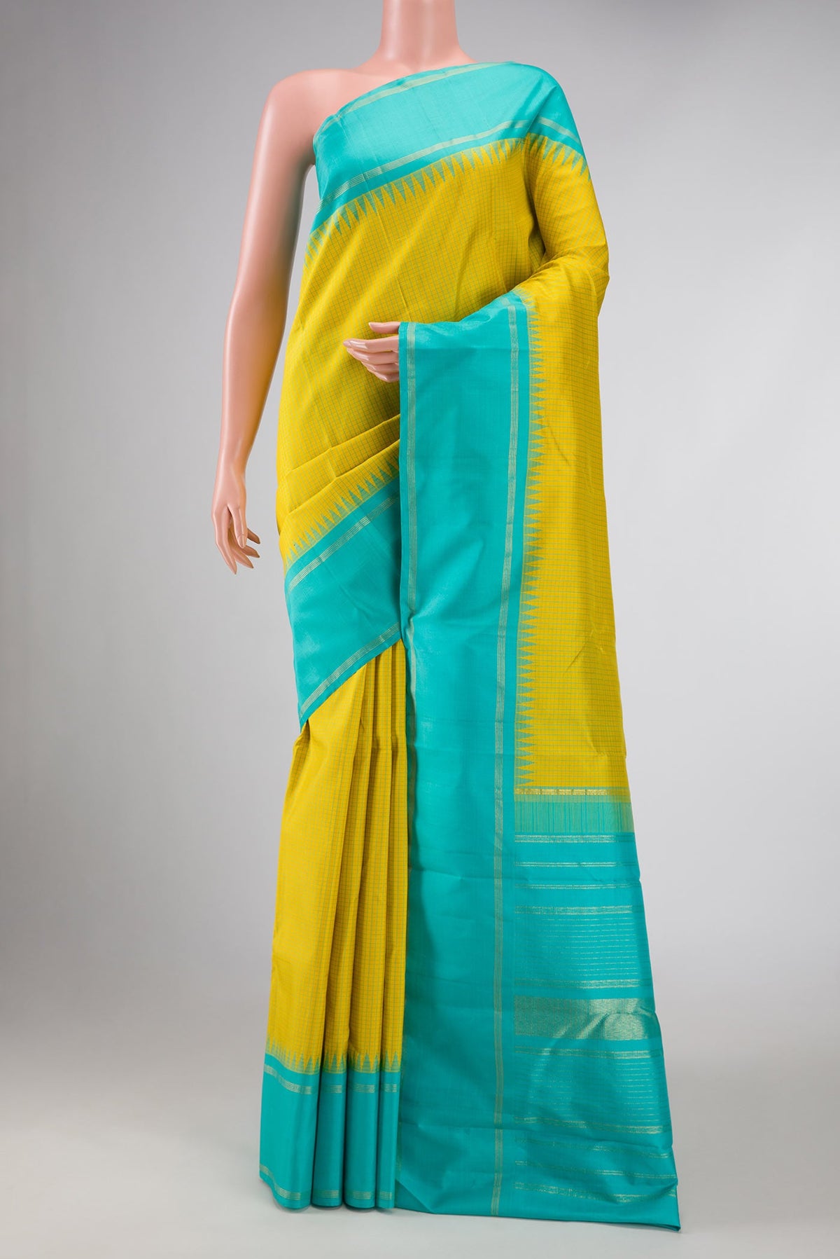 Lemon Yellow Dual Tone Kanchipuram Silk Saree with Checked design on the body and Zari Border displayed on a mannequin