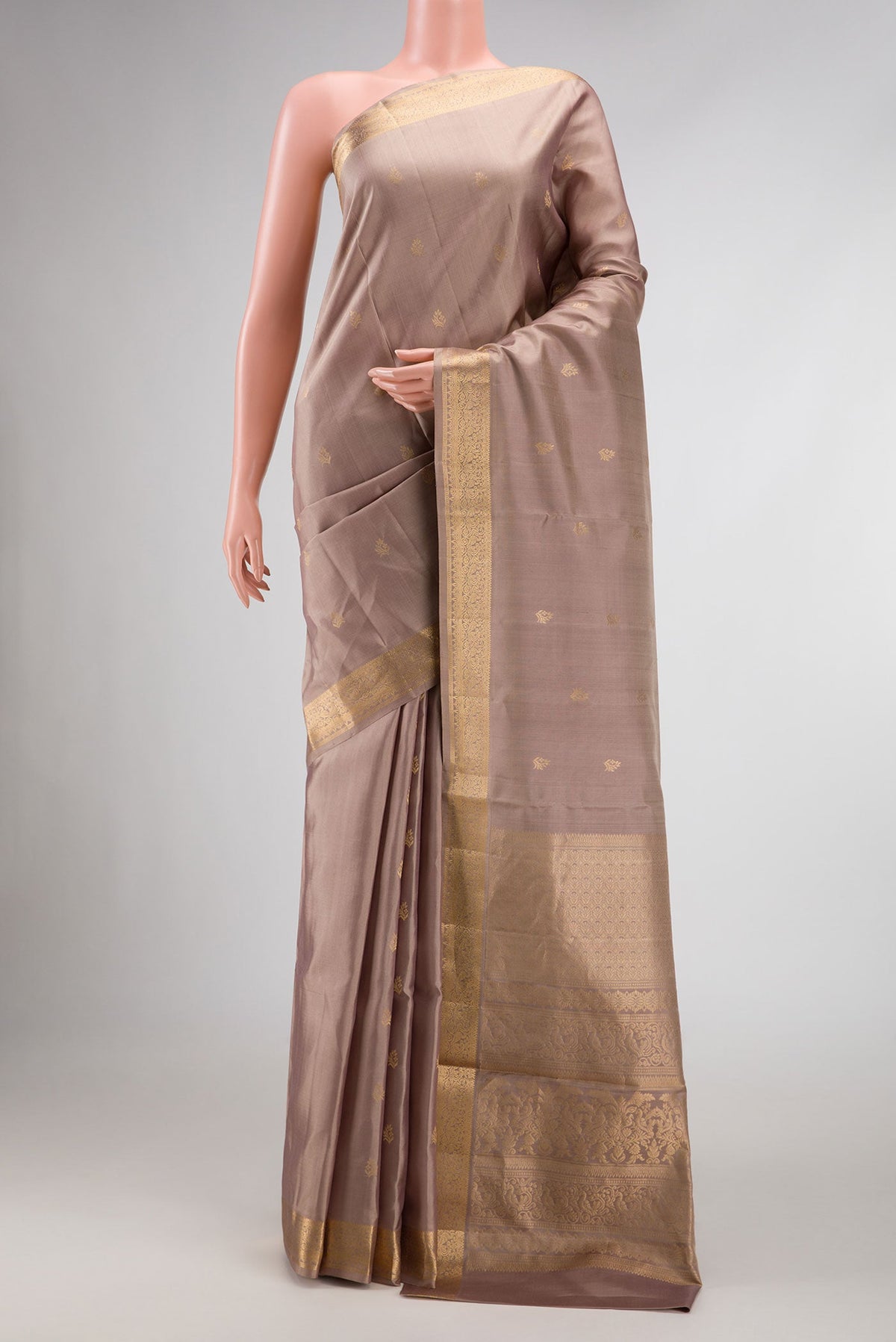 Rose Gold Dual Tone Soft Silk Saree with Zari Butta on the body and Zari Border displayed on a mannequin