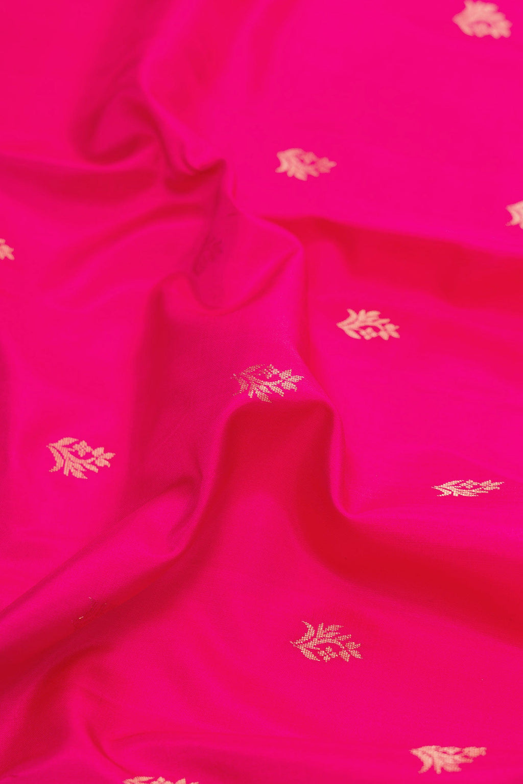 Close up of Dark Pink Dual Tone Soft Silk Saree with Zari Butta on the body and Zari Border displaying folds