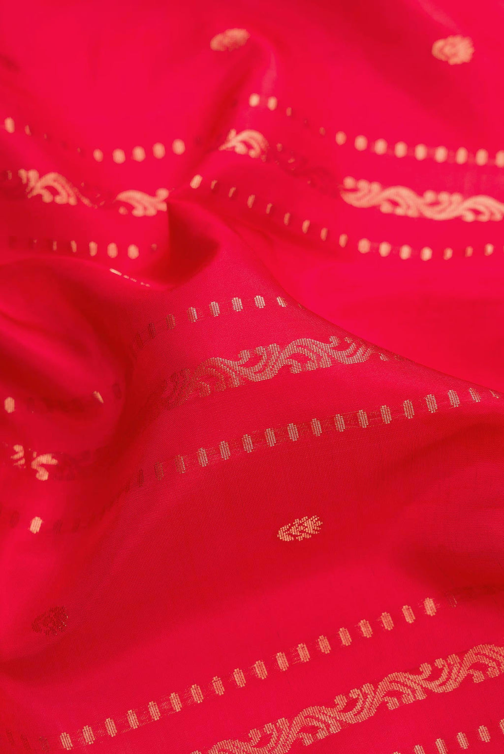 Close up of Red Dual Tone Soft Silk Saree with Stripes on the body and Zari Border.  displaying folds