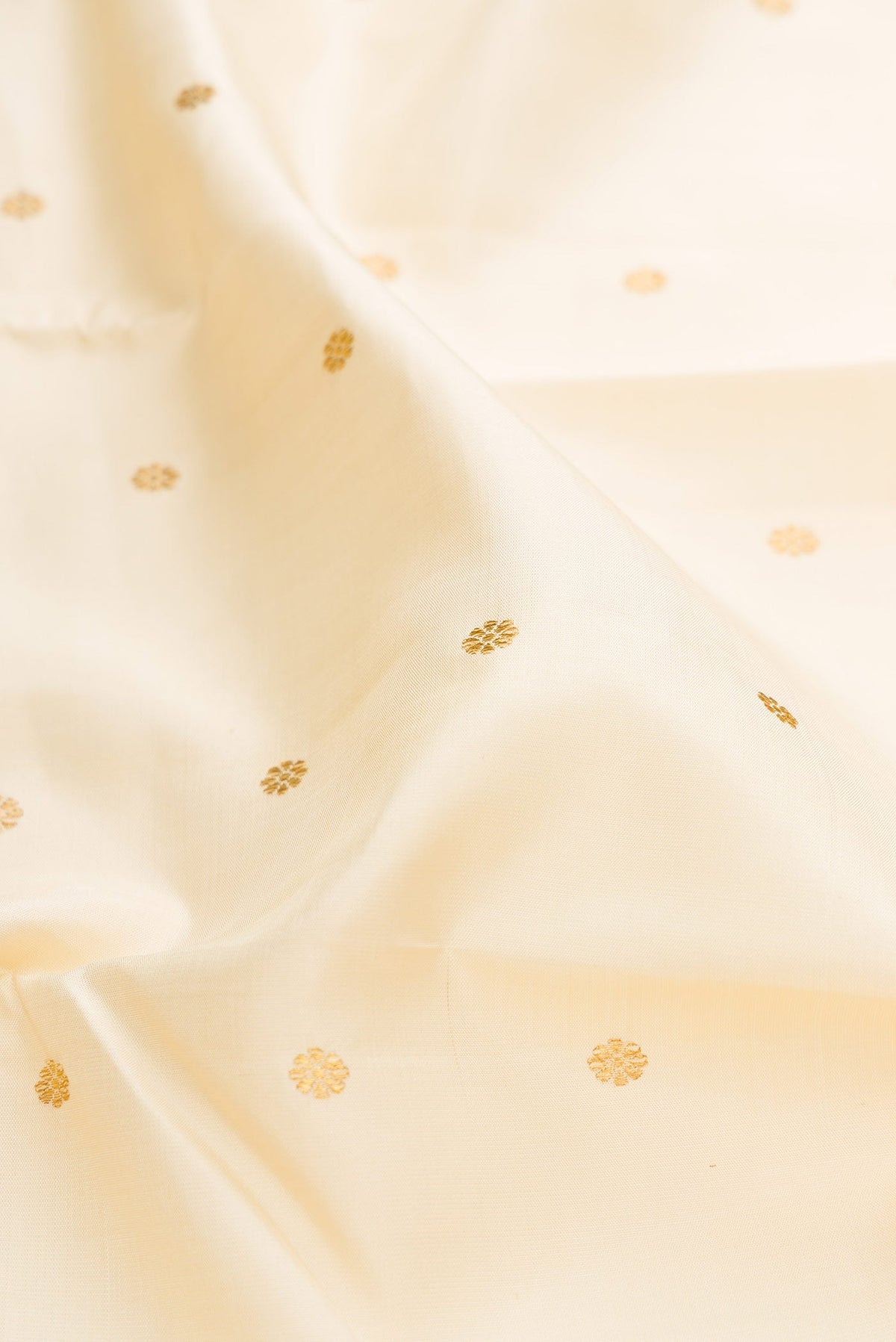 Close up of Pure Silk Pure Zari Sandal Dual Tone Kanchipuram Saree with Zari Butta on the body and Zari Border displaying folds