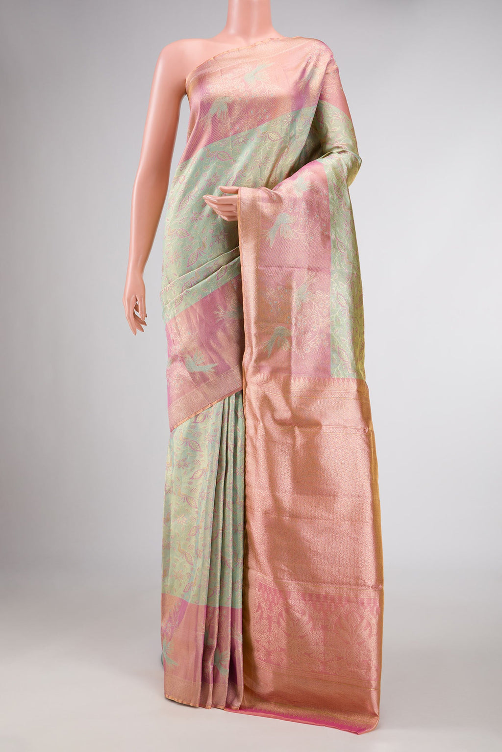 Pista Green Dual Tone Kanchipuram Tissue Silk Saree with Zari Brocade on the body and Zari Border displayed on a mannequin