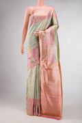 Pista Green Dual Tone Kanchipuram Tissue Silk Saree with Zari Brocade on the body and Zari Border displayed on a mannequin