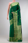 Green Dual Tone Kanchipuram Silk Saree with Zari Butta on the body and Zari Border.  displayed on a mannequin