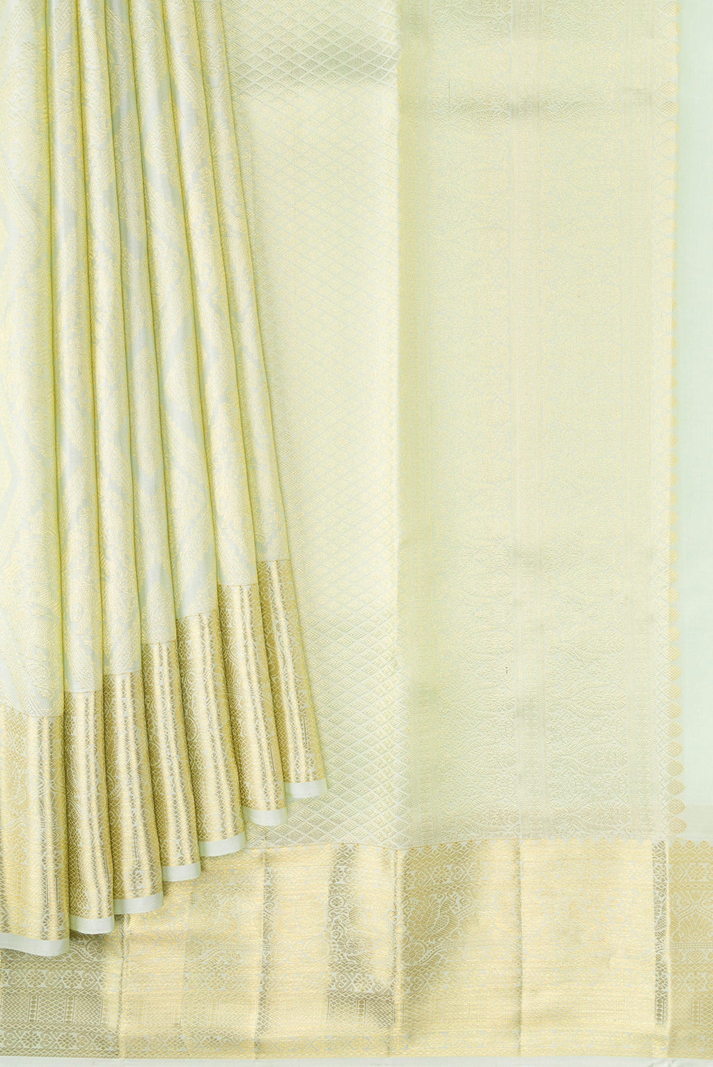 Pleats and pallu of Pista Green Dual Tone Kanchipuram Silk Saree with Zari Brocade on the body and Zari Border. 