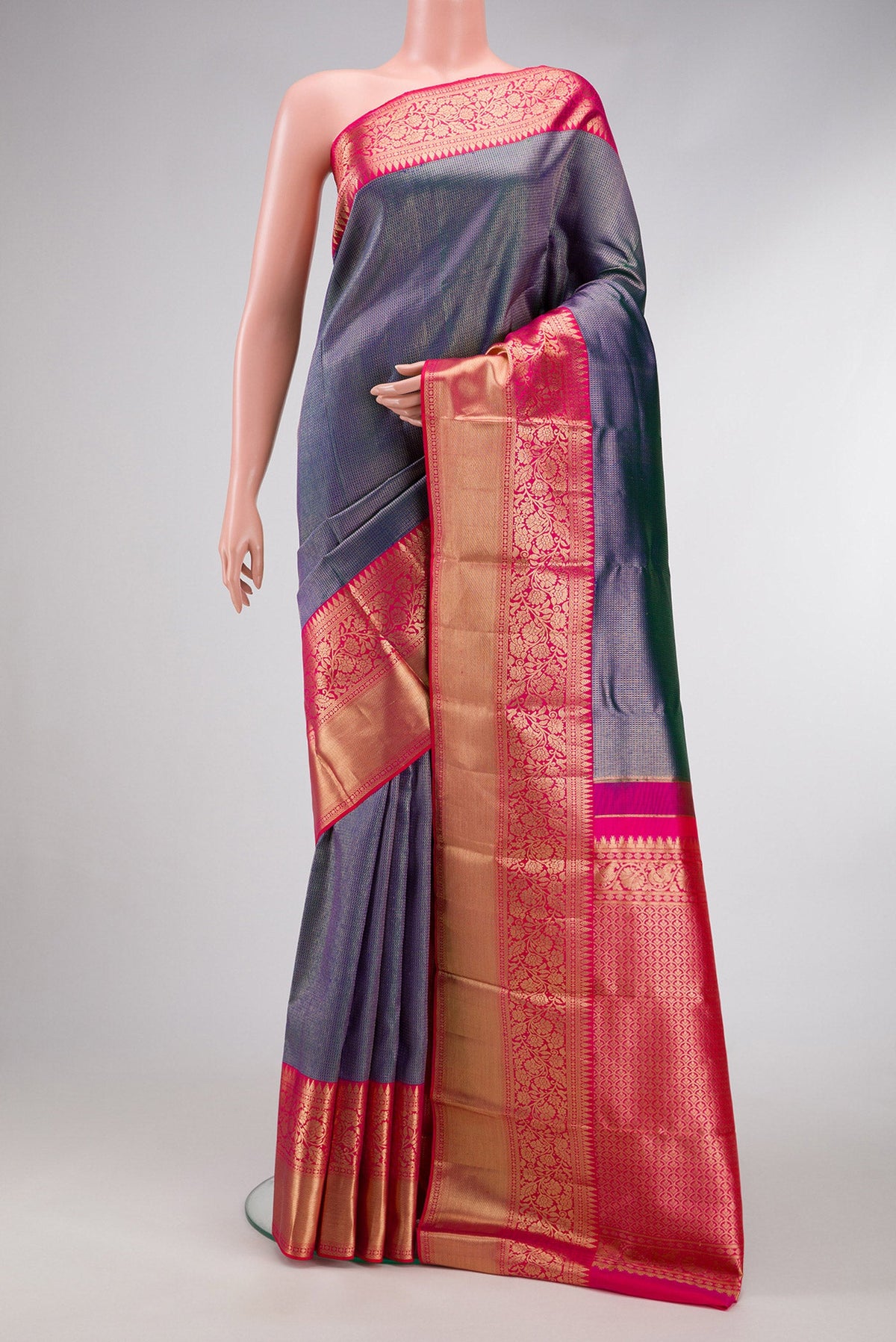 Peacock Blue Dual Tone Kanjivaram Silk Saree with Zari Brocade on the body and Zari Border.  displayed on a mannequin