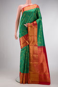 Green Dual Tone Kanchipuram Silk Saree with Zari Brocade on the body and Zari Border.  displayed on a mannequin