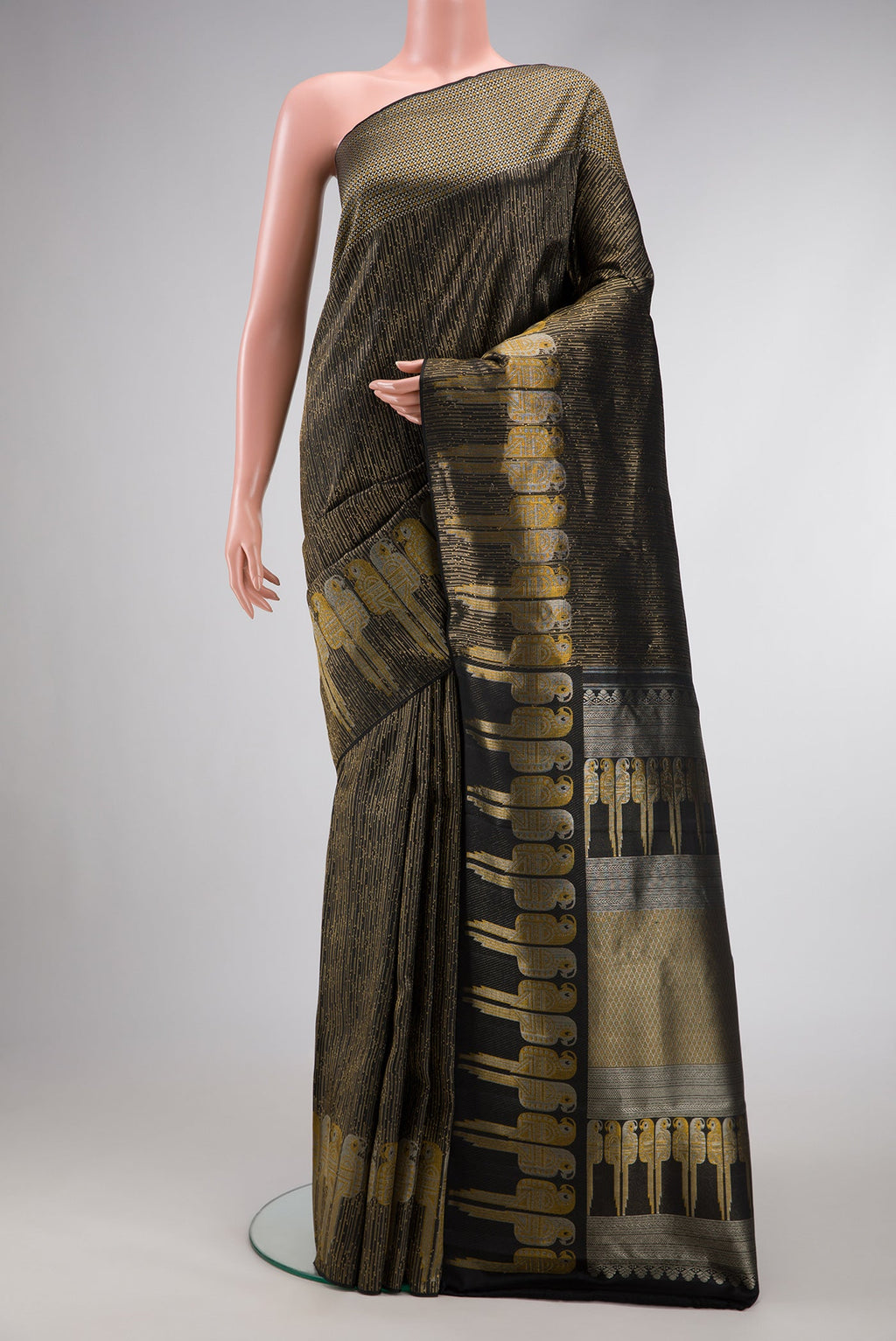 Black Dual Tone Kanjivaram Silk Saree with Zari Brocade on the body and Fancy Border.  displayed on a mannequin