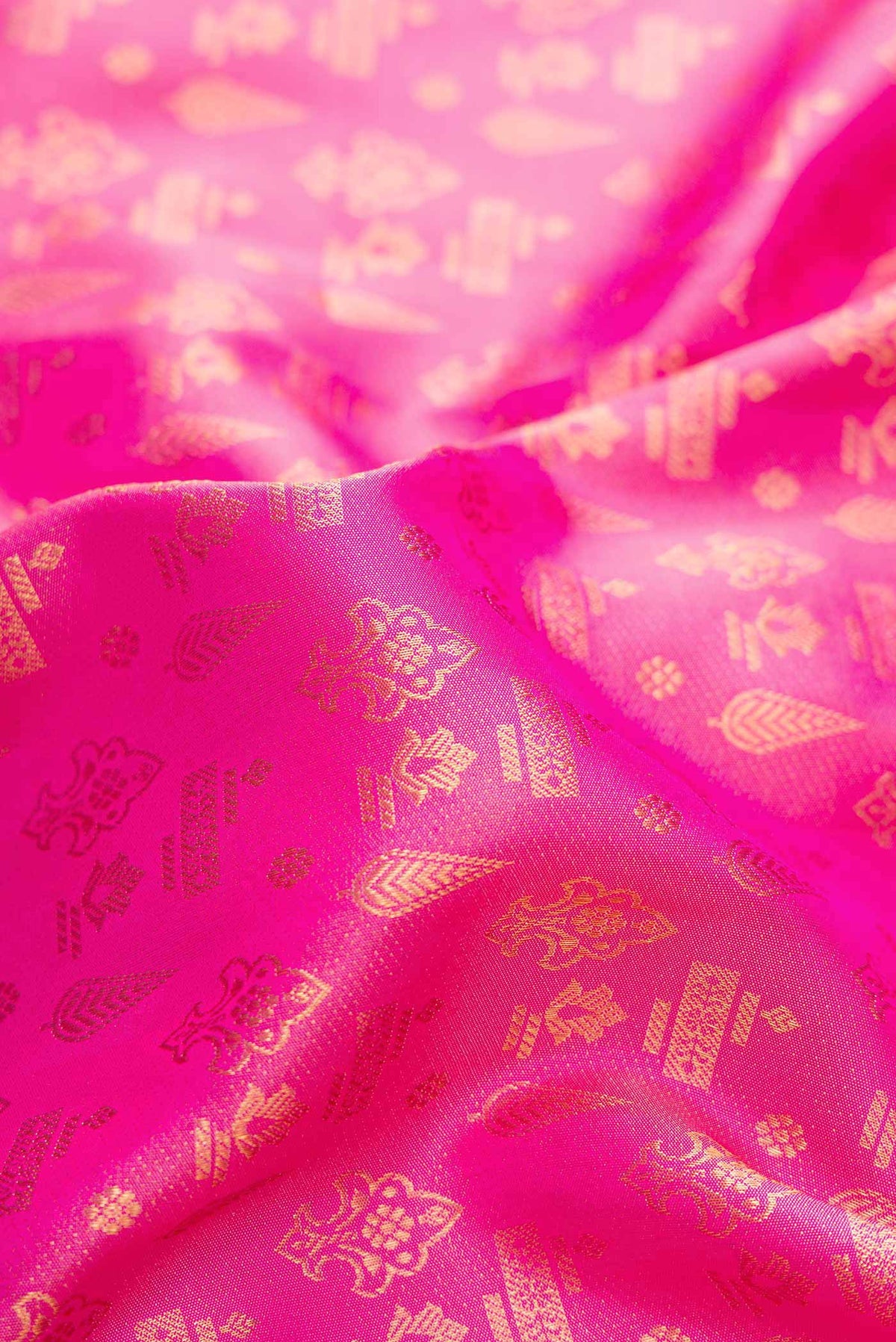 Close up of Pink Dual Tone Kanjivaram Silk Saree with Zari Brocade on the body and Fancy Border.  displaying folds