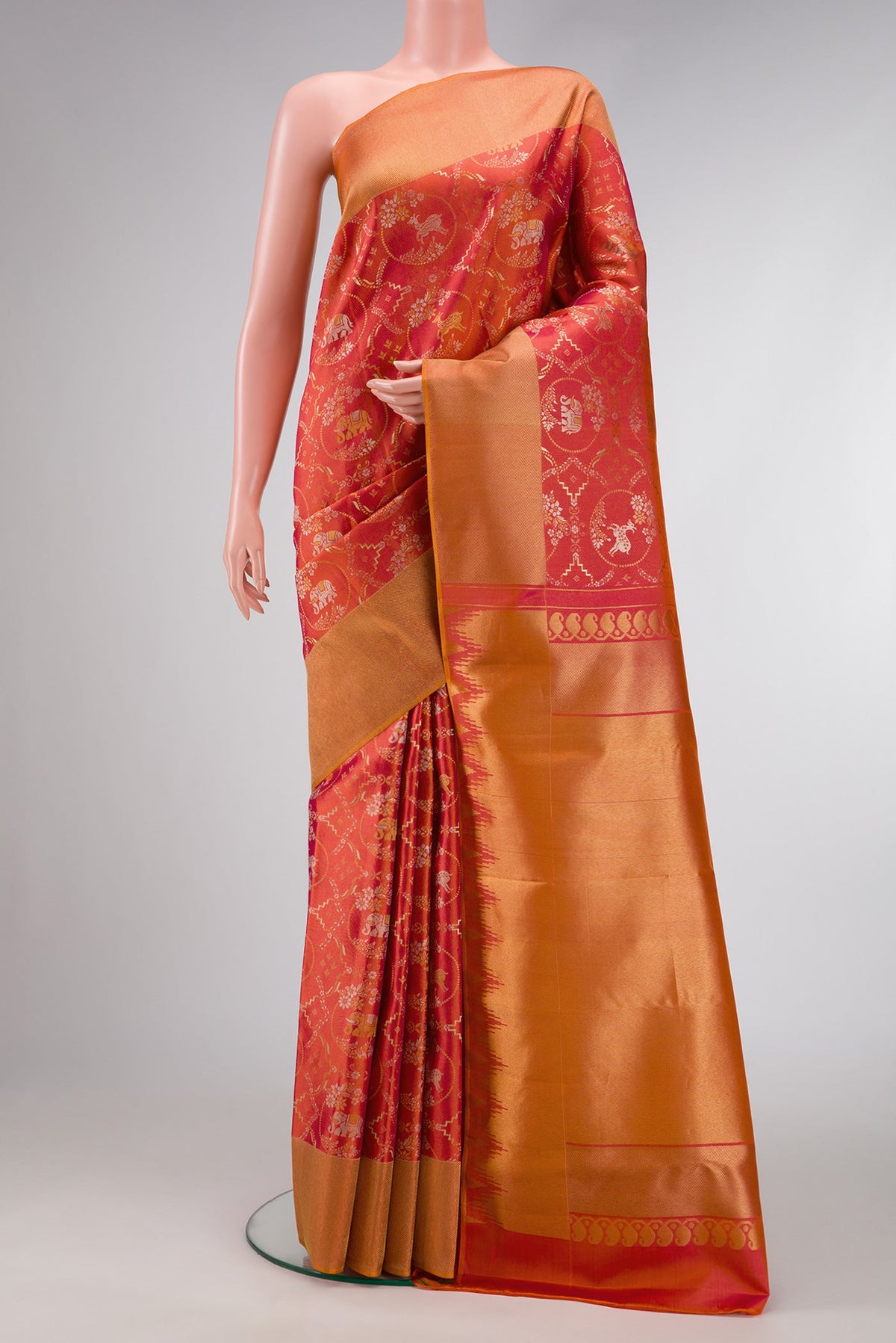 Brick Orange Dual Tone Kanjivaram Silk Saree with Zari Brocade on the body and Zari Border.  displayed on a mannequin