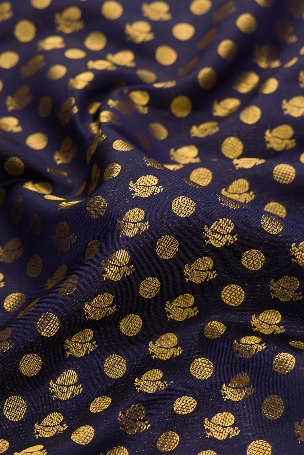 Close up of Navy Blue Dual Tone Kanjivaram Silk Saree with Zari Brocade on the body and Fancy Border.  displaying folds
