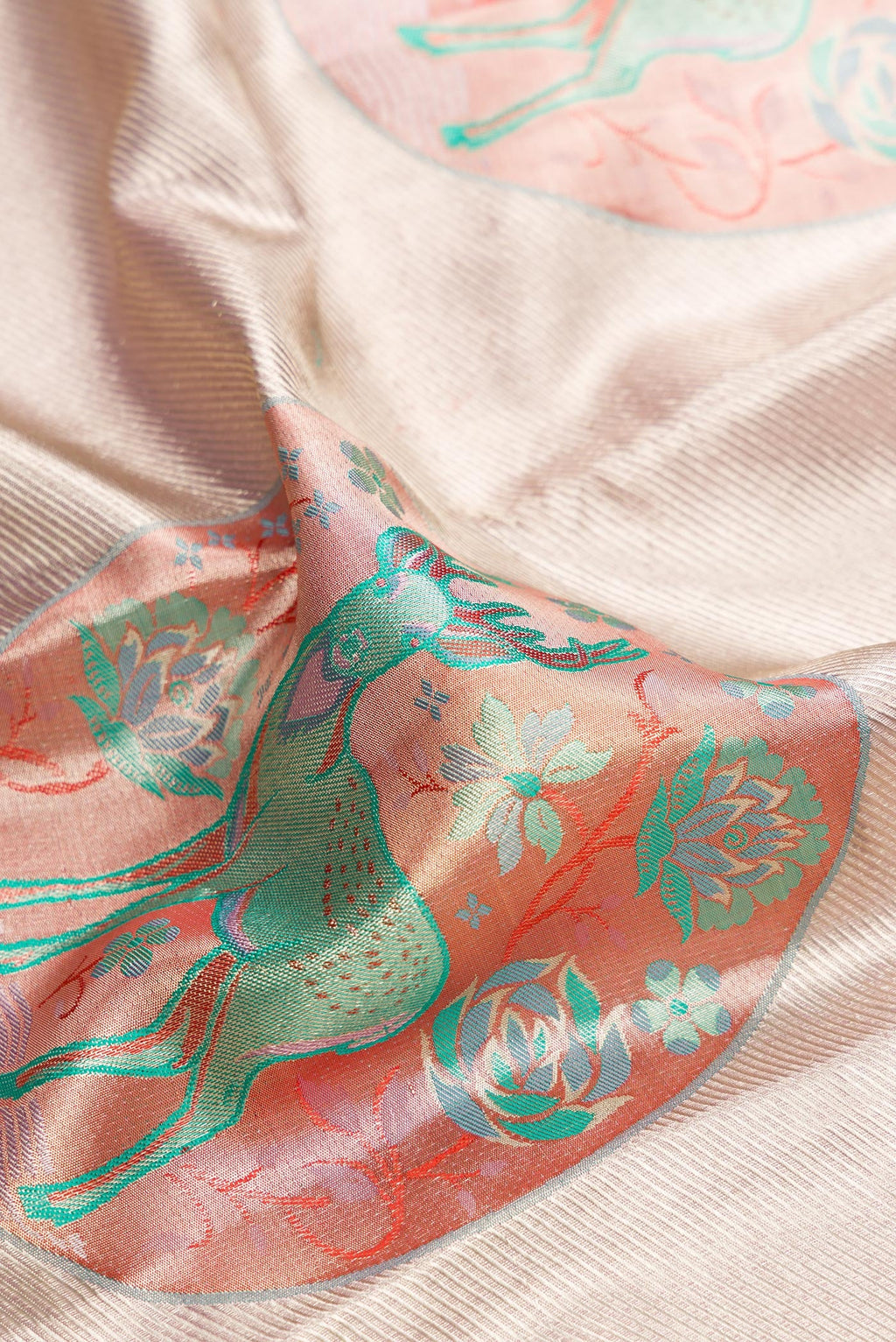 Close up of Lavender Dual Tone Kanjivaram Tissue Silk Saree with Zari Brocade on the body and Zari Border.  displaying folds