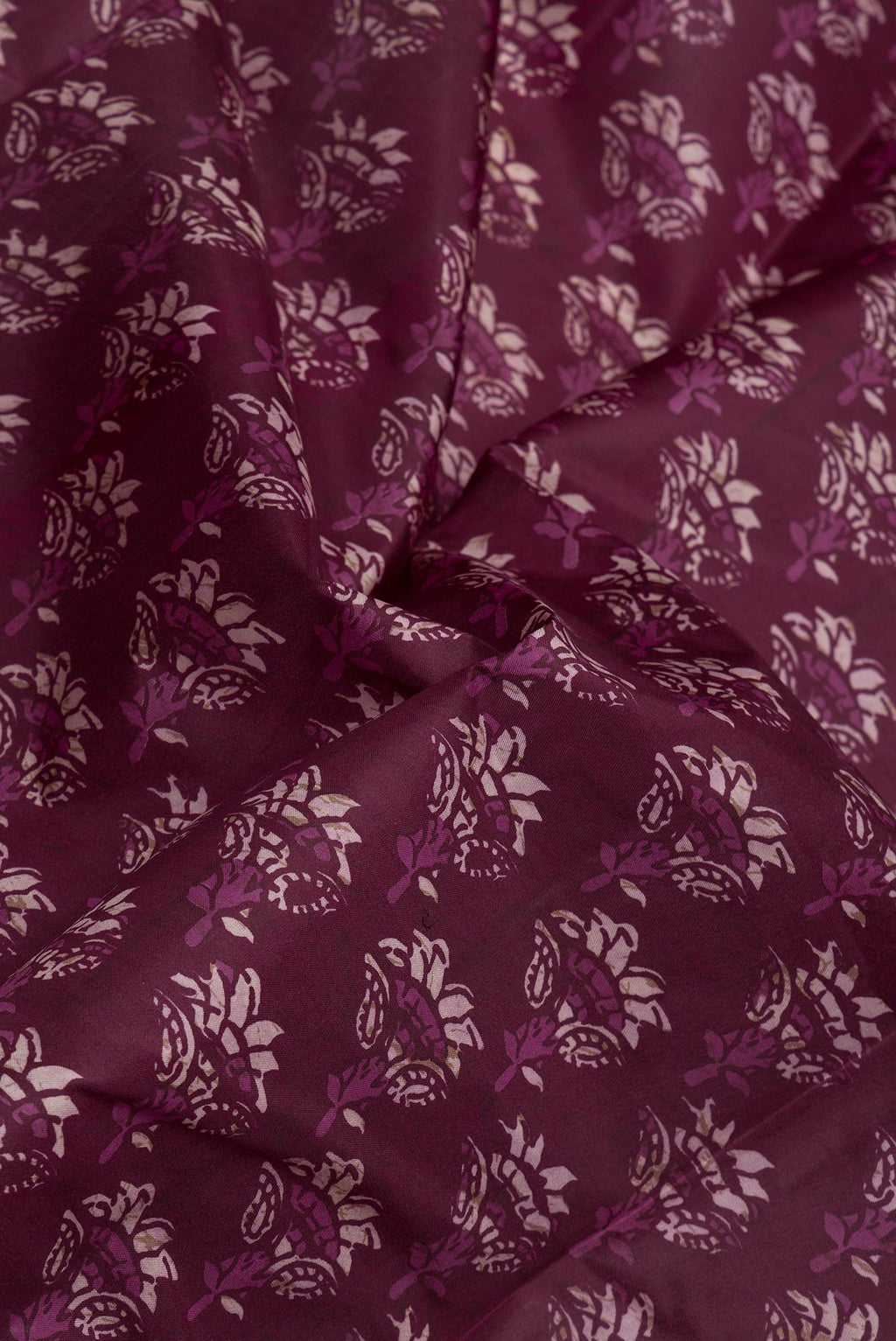 Close up of Purple Printed Silk Saree with Printed design on the body and Printed Border.  displaying folds