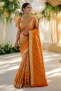 Model wearing a Orange Dual Tone Kanchipuram Tissue Silk Saree with Zari Brocade on the body and Zari Border.