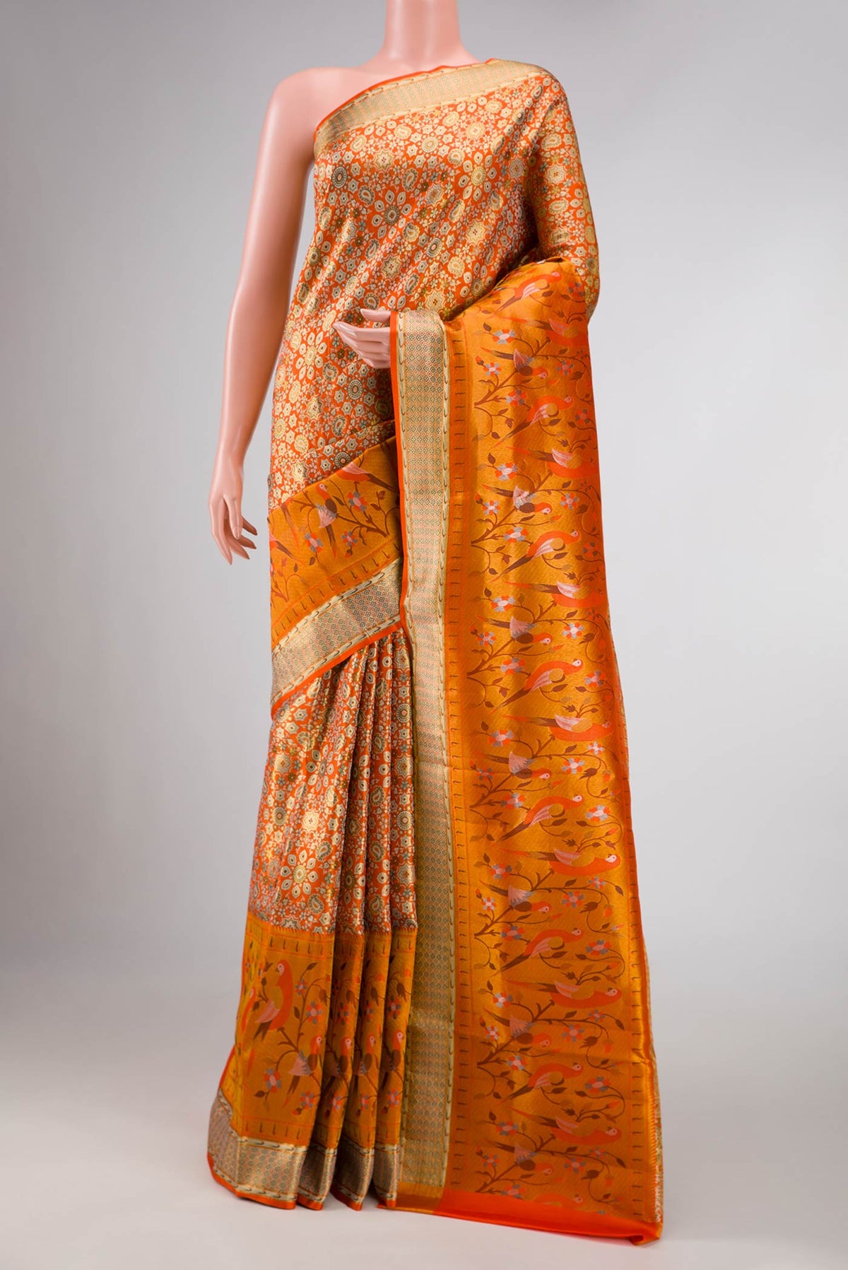 Orange Dual Tone Kanchipuram Tissue Silk Saree with Zari Brocade on the body and Zari Border displayed on a mannequin