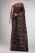 Black Dual Tone Rajkot Patola Silk Saree with Ikat Print on the body and Zari Border.  displayed on a mannequin