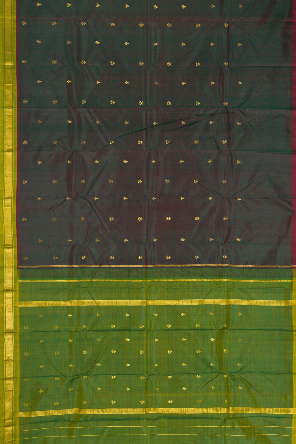 Flat view of Bottle Green Dual Tone Kanchipuram Silk Saree with Zari Butta on the body and Zari Border. 
