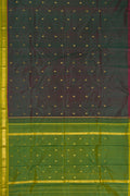 Bottle Green Dual Tone Kanchipuram Silk Saree with Zari Butta on the body and Zari Border.  displayed on a mannequin