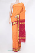 Orange Dual Tone Kanjivaram Silk Saree with Zari Butta on the body and One Side Border.  displayed on a mannequin