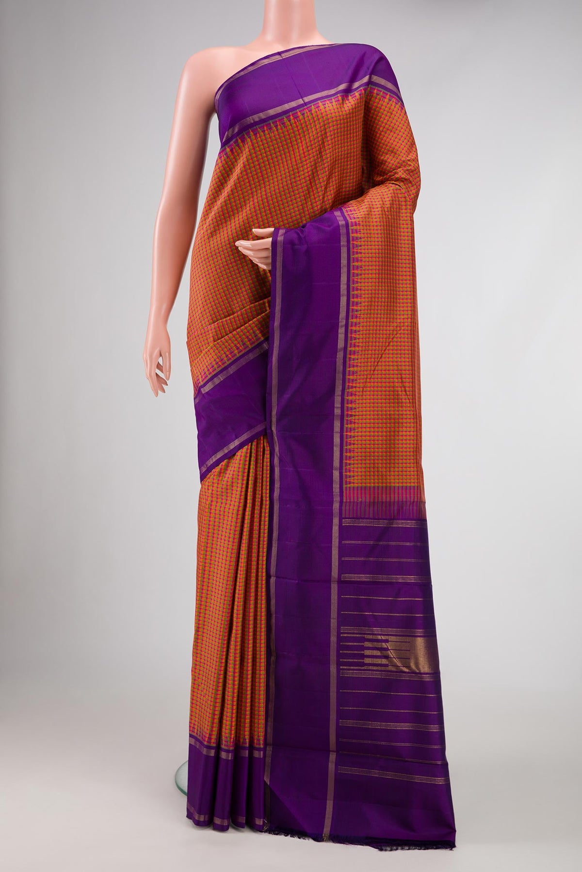Pink, Green and Orange Color Kanjivaram Silk Saree with Checked design on the body and Zari Border.  displayed on a mannequin