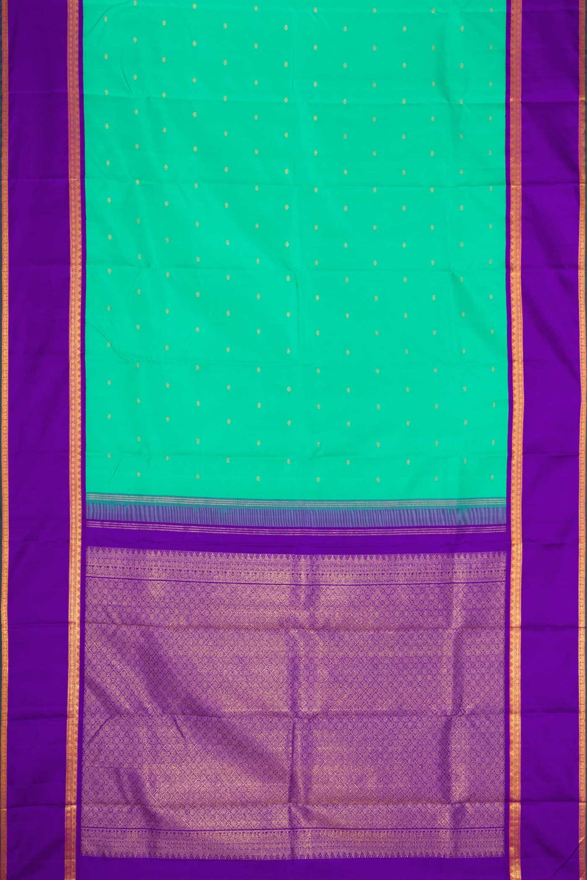 Flat view of Sea Green Dual Tone Kanjivaram Silk Saree with Zari Butta on the body and Zari Border. 