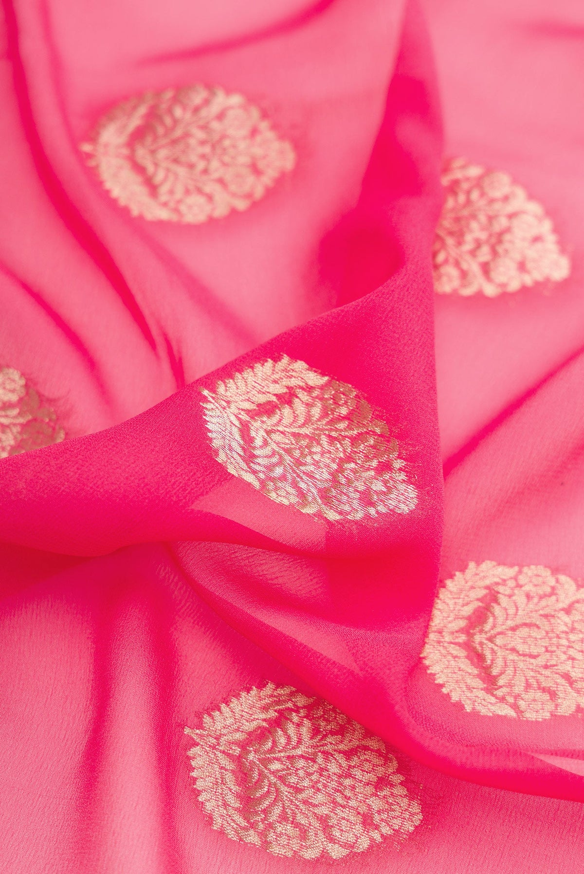 Close up of Pink Mysore Georgette Saree with Zari Butta on the body and Zari Border.  displaying folds