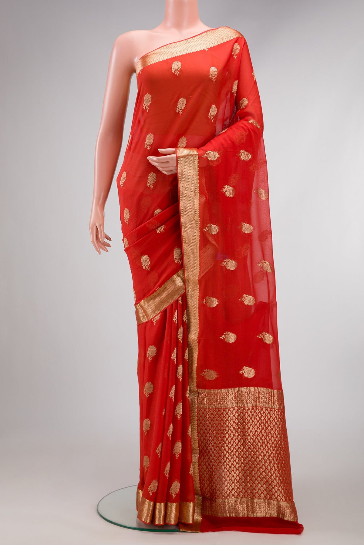 Brick Orange Dual Tone Mysore Georgette Saree with Zari Butta on the body and Zari Border.  displayed on a mannequin