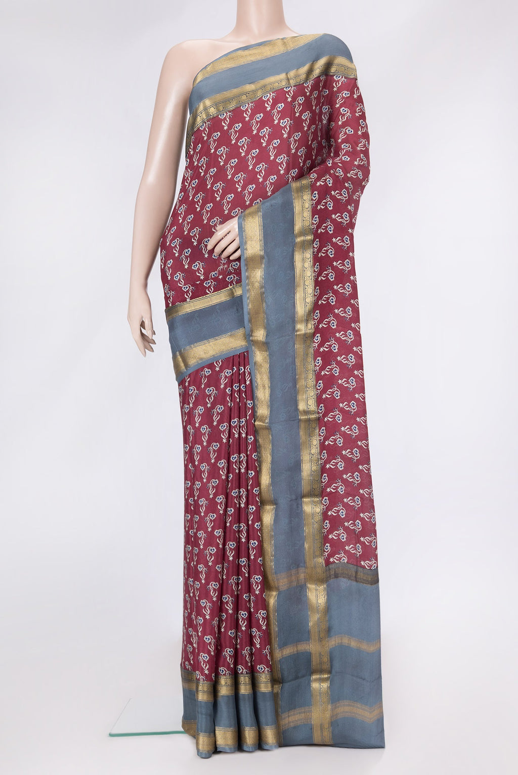 Maroon Dual Tone Mysore Crepe Saree with Printed design on the body and Zari Border.  displayed on a mannequin