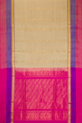 Beige Soft Silk Saree with Zari Butta on the body and Zari Border.  displayed on a mannequin