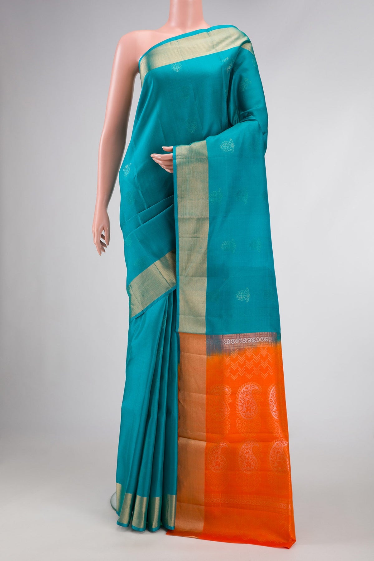 Sky Blue Dual Tone Soft Silk Saree with Zari Butta on the body and Zari Border.  displayed on a mannequin