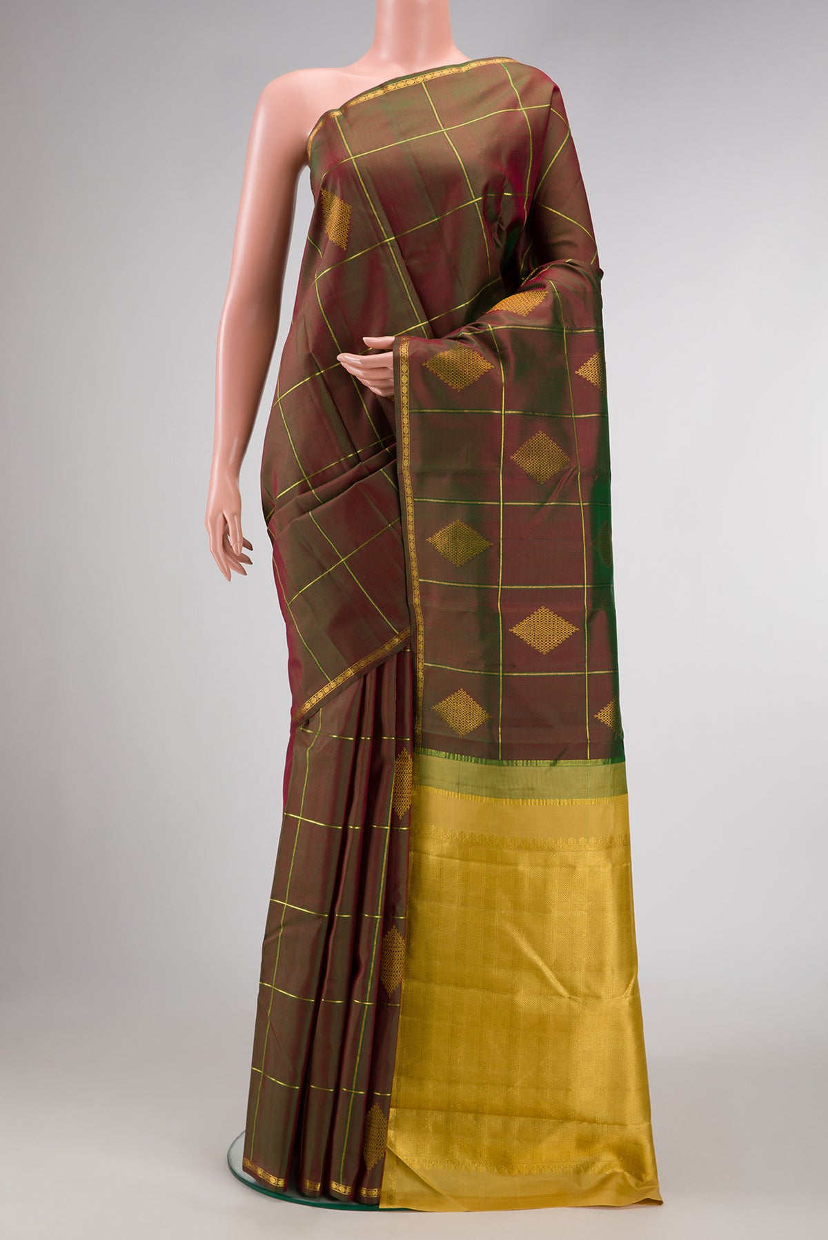 Green with Maroon Color Kanchipuram Silk Saree with Checked design on the body and Thin Zari Line.  displayed on a mannequin