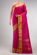 Pink Dual Tone Kanchipuram Silk Saree with Checked design on the body and Zari Border.  displayed on a mannequin