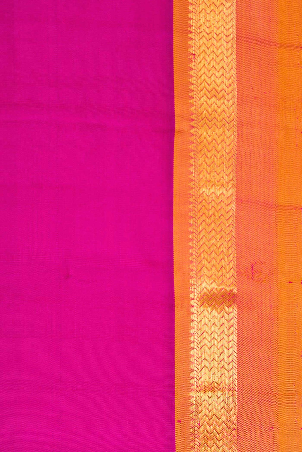 Border image of Magenta Dual Tone Kanjivaram Silk Saree with Plain Body and Zari Border. 