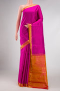 Magenta Dual Tone Kanjivaram Silk Saree with Plain Body and Zari Border.  displayed on a mannequin