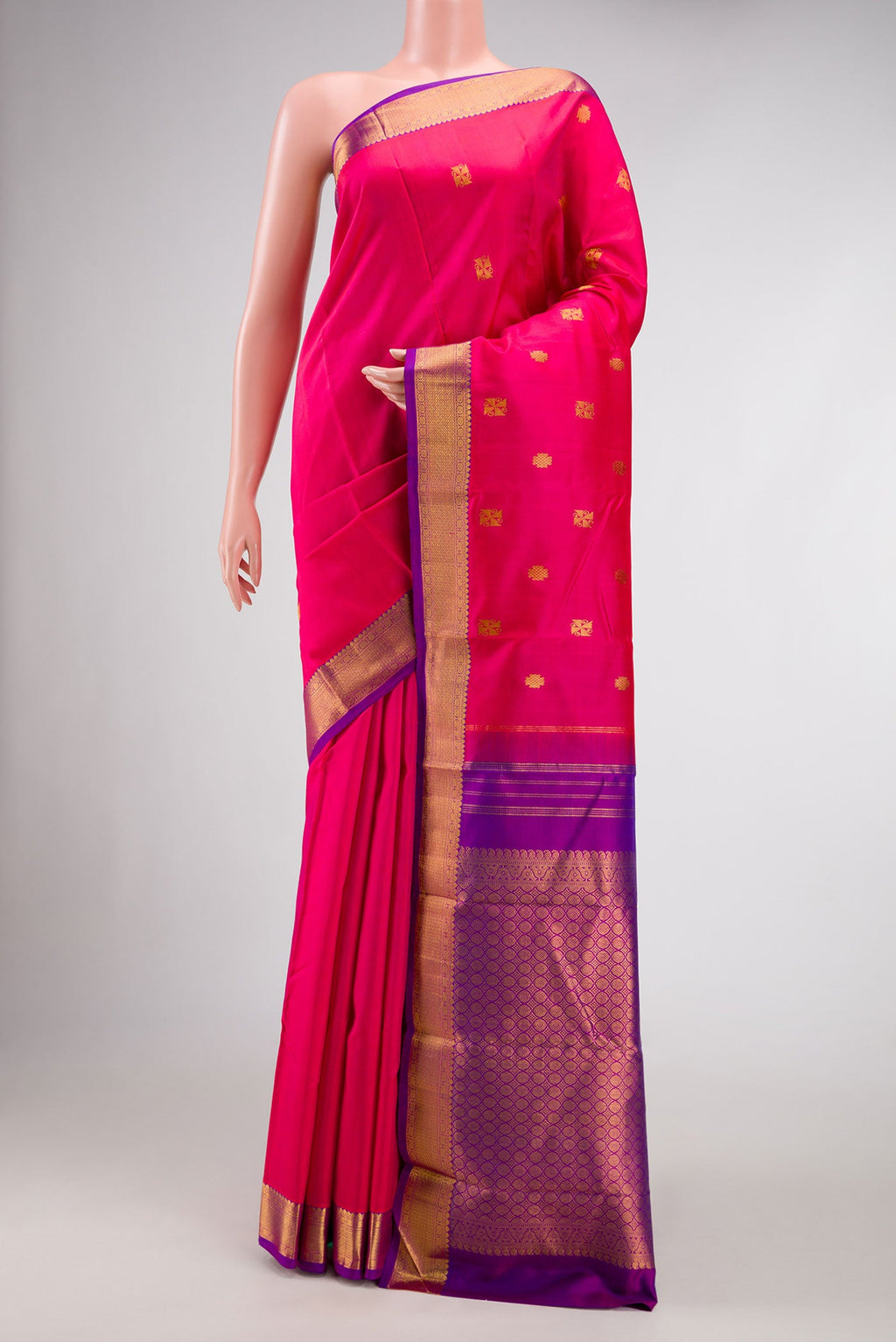 Pink Dual Tone Kanchipuram Silk Saree with Zari Butta on the body and Zari Border.  displayed on a mannequin