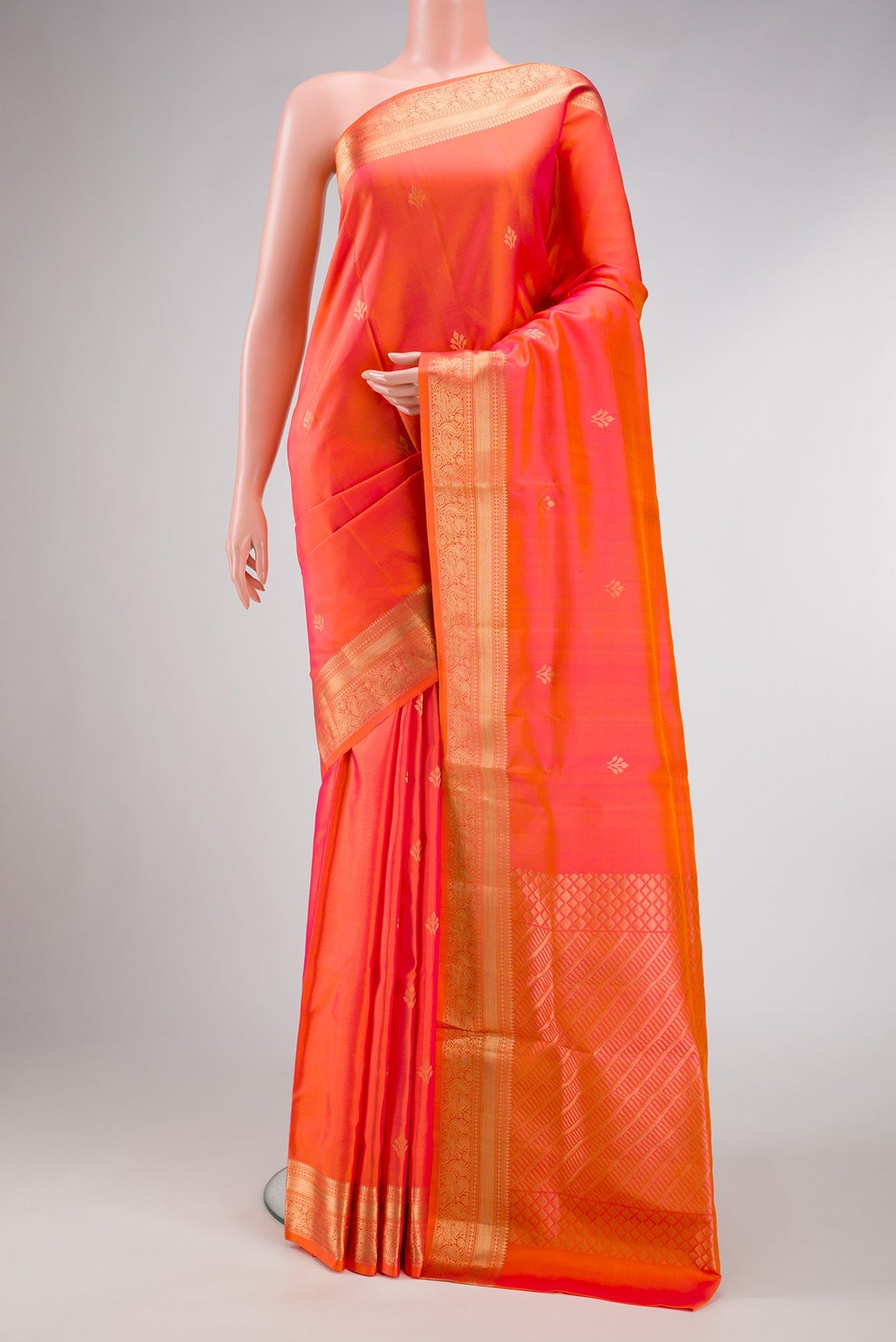 Orange Dual Tone Soft Silk Saree with Zari Butta on the body and Zari Border.  displayed on a mannequin