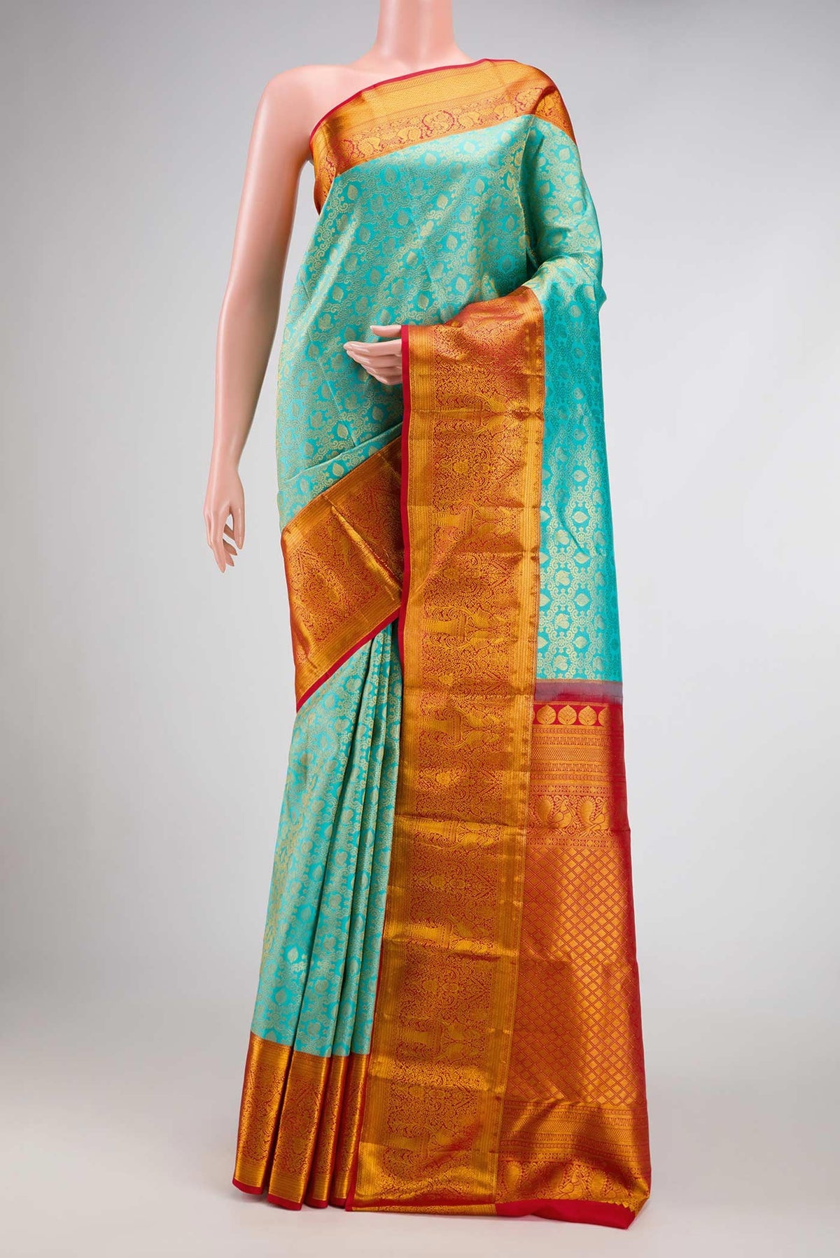 Sky Blue Dual Tone Kanchipuram Silk Saree with Zari Brocade on the body and Zari Border.  displayed on a mannequin