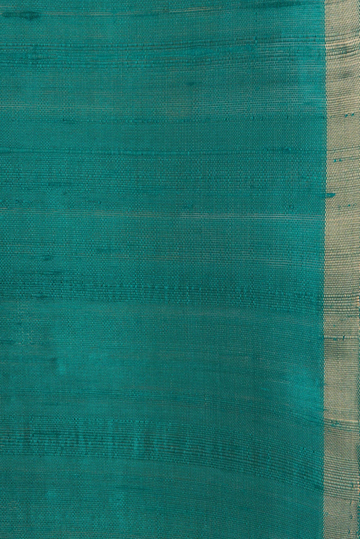 Border image of Peacock Blue Dual Tone Raw Silk Saree with Plain Body and Thin Zari Line. 