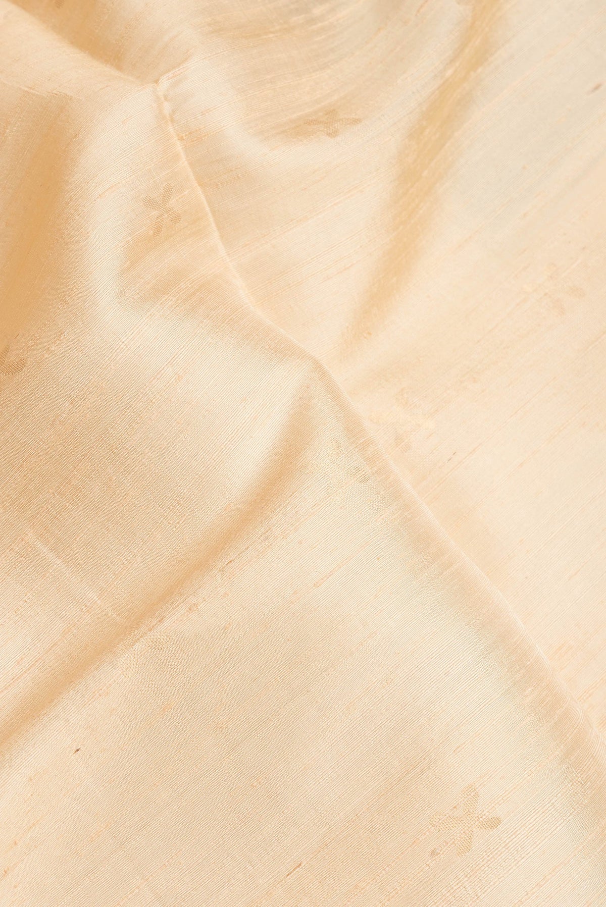 Close up of Sandal Dual Tone Raw Silk Saree with Zari Butta on the body and Thin Zari Line.  displaying folds