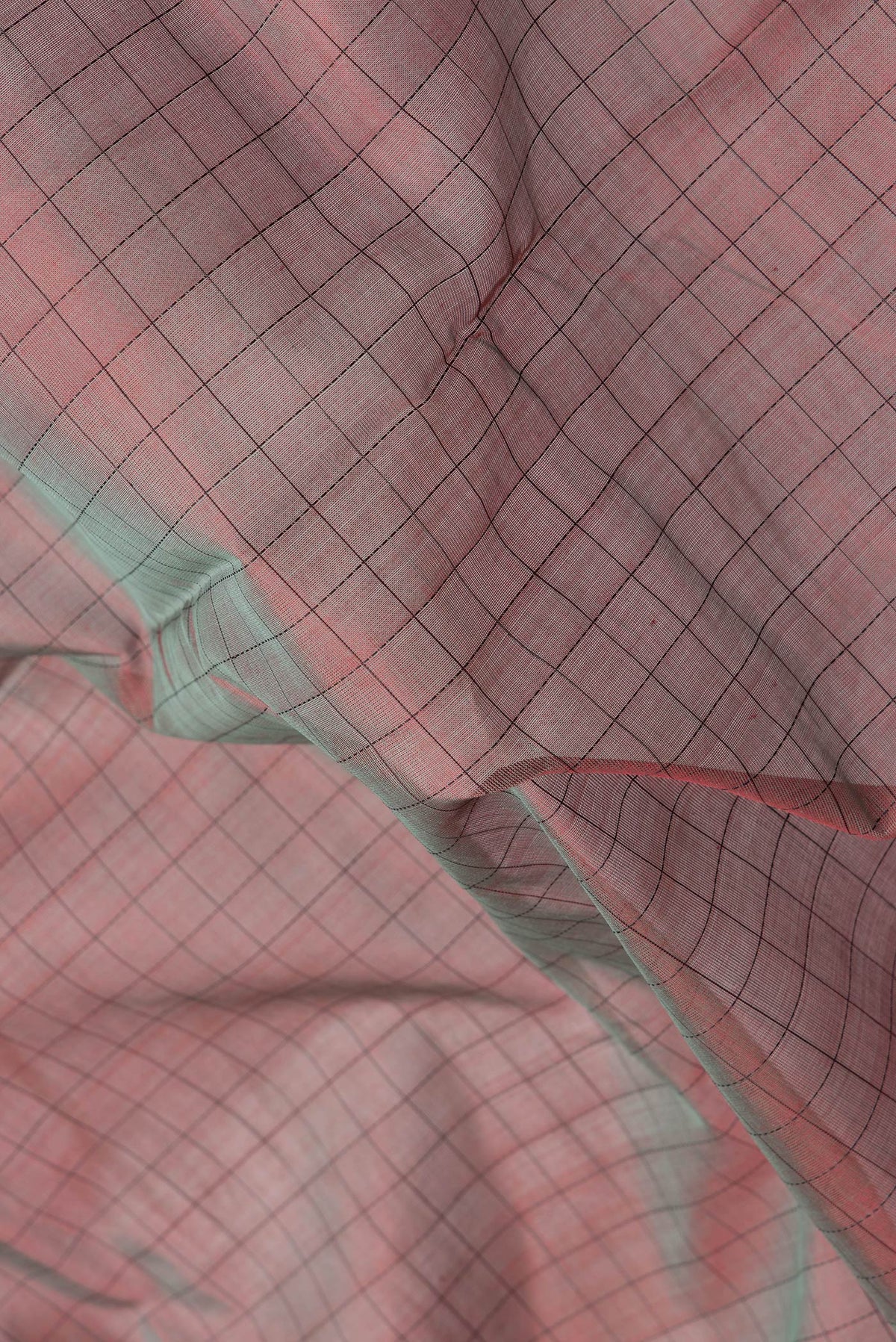 Close up of Mehandi Green Dual Tone Silk Cotton Saree with Checked design on the body and Fancy Border.  displaying folds