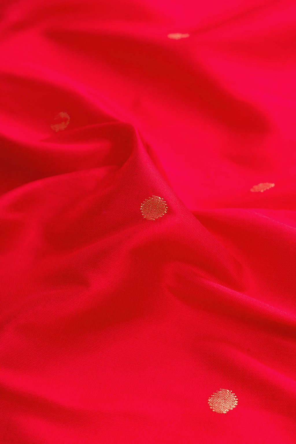 Close up of Red Dual Tone Paithani Silk Saree with Zari Butta on the body and Paithani Border displaying folds